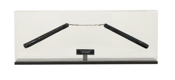A photo of the pair of nunchaku up for bid.