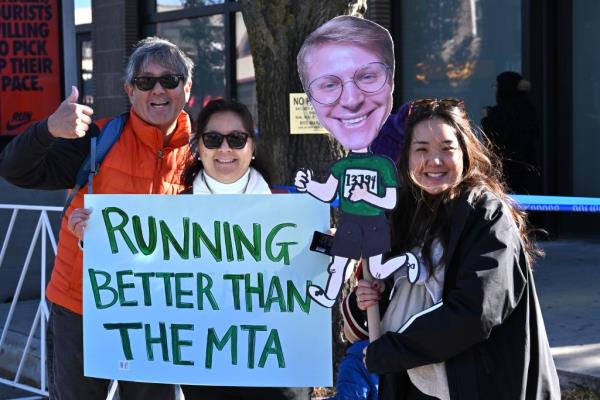 Some spectators invented humorous signs that took pokes at city institutions, such as the MTA.