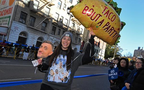 Sarah Montes, 29, held a floating taco balloon so her boyfriend, Matthew Simonian, would see it.