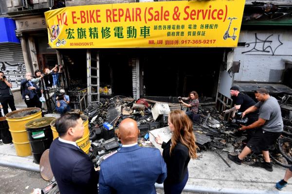 Kavanagh and Adams inspecting damage from an e-bike battery fire in Manhattan on June 21, 2023.
