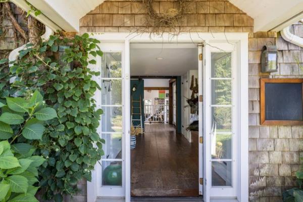 The cozy Hamptons home began life as a barn in 1920, exterior. 