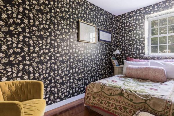 Funky wallpaper adds to the eclectic decor, interior. 