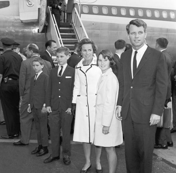Robert F. Kennedy and his family return to New York after a trip to Europe. His wife Ethel, and children Joseph Patrick II, Robert Francis, Jr., and Kathleen stand with him.