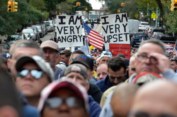 Service members subject to the 2021 citywide workers vaccine mandate protest near the home of then-Mayor Bill de Blasio.