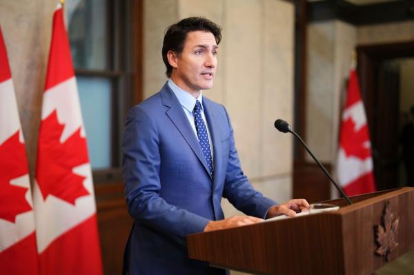 Canadian Prime Minister Justin Trudeau is pictured apologizing at a press co<em></em>nference Tuesday.