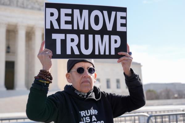 Activists held demo<em></em>nstrations outside the Supreme Court as they called on the judges to uphold Colorado's decision.