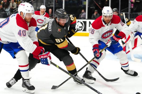 Hockey players on the ice together. 