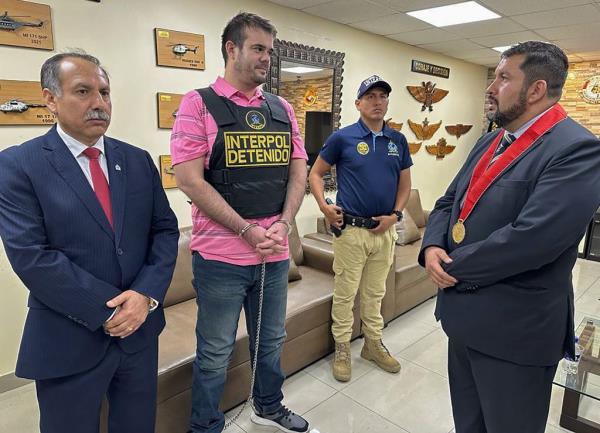 Police show Joran Van Der Sloot (2-L) being handed over to local authorities in Callao, upon returning to Peru on Oct. 31, 2023.