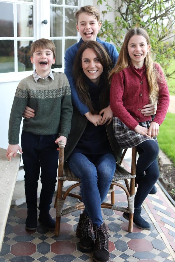 Kate Middleton, seated, with her three children standing around her