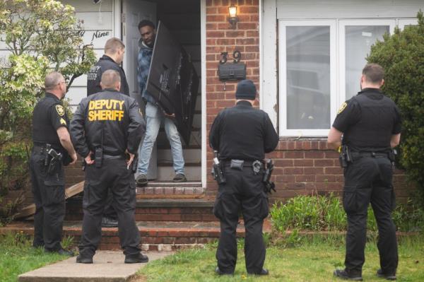  Nassau County Sheriffs evict Denton Gayle from 39 Brusssel Drive , New Hyde Park,  NY,  Credit J.C.Rice
