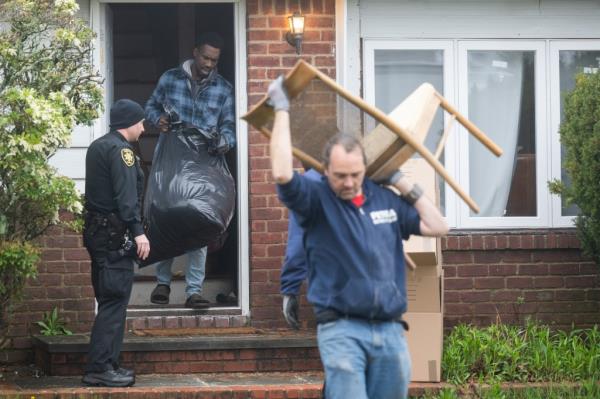 240412_ Nassau County Sheriffs evict Denton Gayle (center left) from 39 Brusssel Drive , New Hyde Park,  NY,  Credit J.C.Rice
