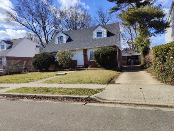 Denton Gayle and Margaret Grover squatting in a two-story house, surrounded by trees, at 39 Brussel Dr. New Hyde Park, LI