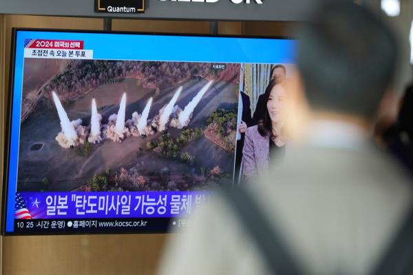 A TV screen shows a report of North Korea's multiple short-range ballistic missiles with file footage during a news program at the Seoul Railway Station in Seoul, South Korea.