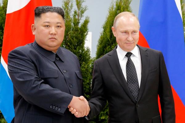 Russian President Vladimir Putin, right, and North Korea's leader Kim Jong Un shake hands during their meeting in Vladivostok, Russia, on April 25, 2019. 