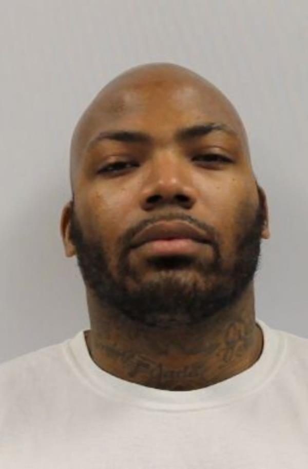 Mugshot of Jason Billingsley, a bearded black man in a white shirt, who was sentenced to life for the murder of Pava LaPere and attempted murders of two others.