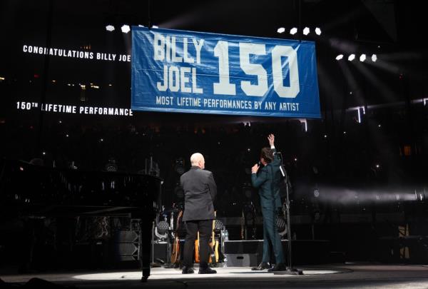 Billy Joel and Jimmy Fallon admiring his MSG banner for 150 career shows.