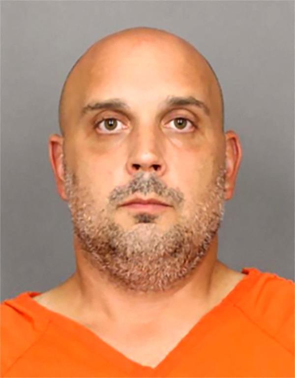 Sean M. Higgins posing for a jail booking photograph at Salem County Correctio<em></em>nal Facility, New Jersey, U.S. in an orange shirt on August 30, 2024.
