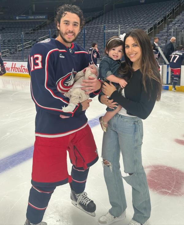 Johnny Gaudreau holding his daughter, Columbus Blue Jackets NHL hockey player