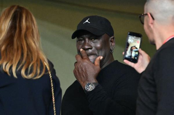 Michael Jordan (C) attends the UEFA Champions League 1st round day 1 football match between AS Mo<em></em>naco and FC Barcelona
