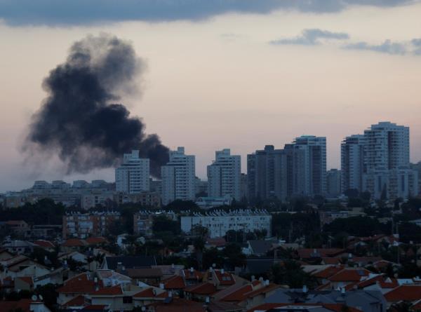 Palestinian militants in the Gaza Strip infiltrated Saturday into southern Israel and fired thousands of rockets into the country while Israel began striking targets in Gaza in response.