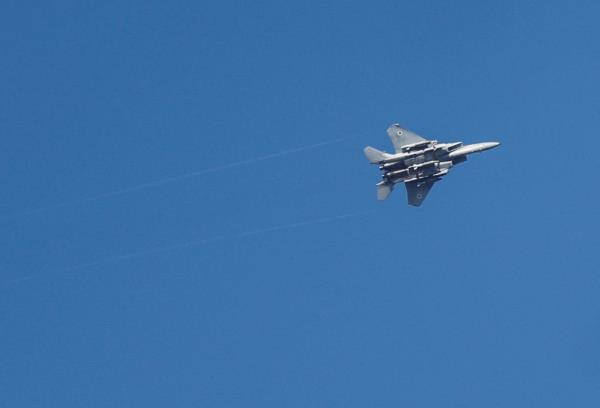 An Israeli war jet is seen as rocket barrages are launched from the Gaza Strip, in Ashdod, Israel October 7, 2023.