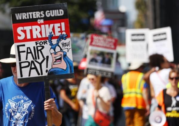 Striking WGA members pictured picketing