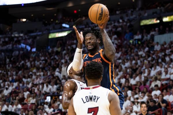 Julius Randle #30 of the New York Knicks puts up a shot over Kyle Lowry #7 of the Miami Heat