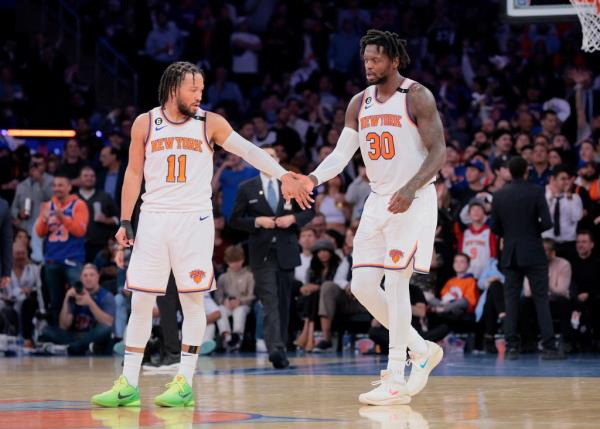 Knicks guard Jalen Brunson #11 greets New York Knicks forward Julius Randle