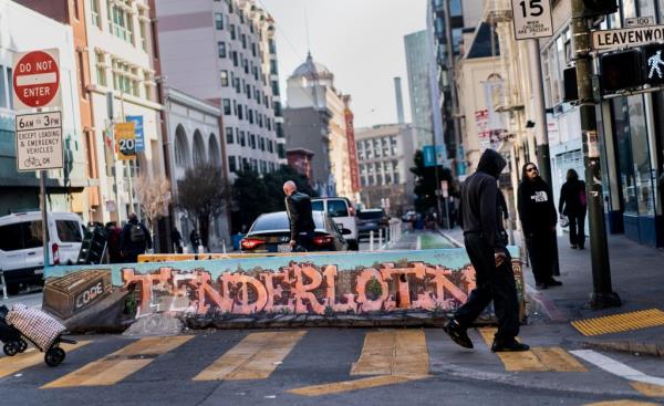 people all walk to work and hang out in the Tenderloin neighborhood of San Francisco, California Wednesday January 26, 2022.
