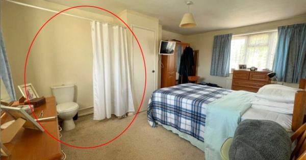 Story from Jam Press (Toilet Curtain) Pictured: The property in Barrow, near Bury St Edmunds, that features a toilet behind a shower curtain in the Master bedroom. Pictured is the bedroom with the toilet behind the shower curtain. Three-bed house for sale for 325,000 with TOILET hidden behind CURTAIN in bedroom A three-bed house for sale has been mocked because it has a TOILET hidden behind CURTAIN in the master bedroom. The semi-detached property is on the market for 325,000. It is well presented from the outside with a well-kept front garden and manicured lawn in the backyard and a garage. There are also solar panels on the roof. There is a spacious lounge diner and fully equipped kitchen and the o<em></em>nly bathroom - with a walk-in shower, toilet and basin - is downstairs. The master bedroom and two smaller o<em></em>nes are upstairs. But eagle-eyed home hunters were quick to spot the bizarre hidden loo. In between a chest of drawers - with picture f<em></em>rames on top - and a wardrobe there is a white toilet. There is no door to shut it off from the rest of the room and o<em></em>nly a shower-style curtain to offer privacy. The house in the village of Barrow, near Bury St Edmunds, Suffolk is being sold by Day and Knight Property and advertised on Rightmove. Local Josh Pearson said: ?I?ve seen some shockers on Rightmove in my time. ?But this is right up there with the worst of ?em.? Another - called Ben - joked it would be good if you needed the loo while playing computer games in bed. He said: ?Every gamers dream.? Estate agents make no mention of the unusual toilet. But they do say there is an ?opportunity to add an ensuite? in the main bedroom. The property listing reads: ?Located in the desirable village of Barrow and offering extensive external space, this property is ideal if you are looking for a home for a growing family. ?Stepping into the spacious hallway, you have access to the whole of the ground floor, with the lounge/diner situated to