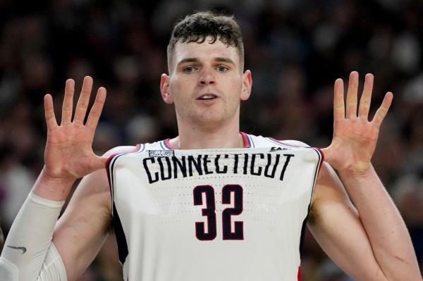 UConn center Do<em></em>novan Clingan, with jersey number 32, celebrating after their win against Purdue in the NCAA College Final Four Champio<em></em>nship Basketball Game, 2024