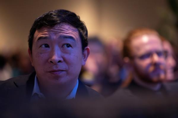Former presidential candidate Andrew Yang watches President Joe Biden speak at South Carolina's First in the Nation Dinner.