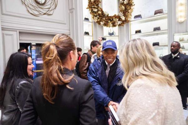 Mayor Adams shaking hands with people at Bergdorf Goodman after attending an open streets event at Fifth Avenue on Dec. 17,  2023.