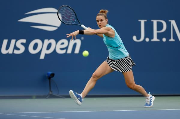 Maria Sakkari hits a tennis ball.