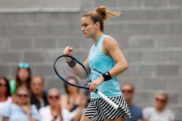 Maria Sakkari pumps her fist.