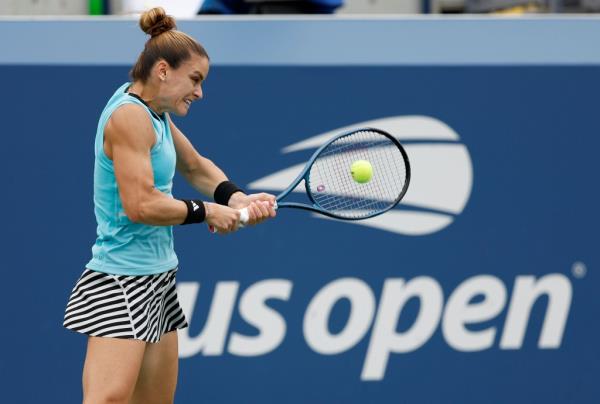 Maria Sakkari hits a tennis ball.