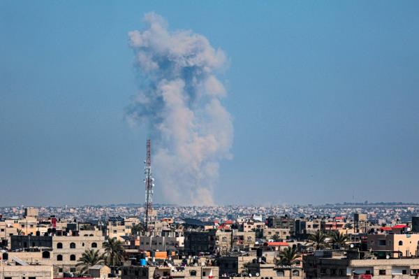 Smoke billowing over a city after an Israeli bombardment in southern Gaza amid o<em></em>ngoing co<em></em>nflict between Israel and Palestinian militant group.