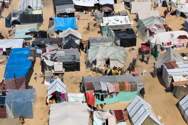 Displaced Palestinians shelter in a tent camp in Rafah, southern Gaza Strip, due to Israeli strikes.