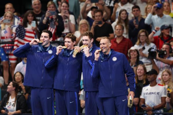Gold Medalists, Jack Alexy, Chris Guiliano, Hunter Armstrong and Caeleb Dressel of Team United States look on during the Medal Ceremony after the Men's 4x100m Freestyle Relay Final on day one of the Olympic Games Paris 2024 at Paris La Defense Arena on July 27, 2024 in Nanterre, France.