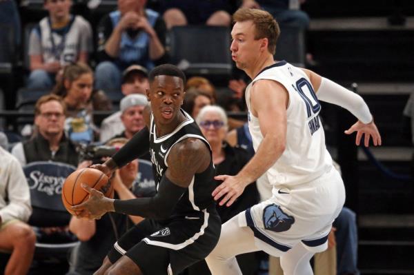 Nets guard Dennis Schroder handles the ball as Memphis Grizzlies guard Luke Kennard defends during the first half at FedExForum. 