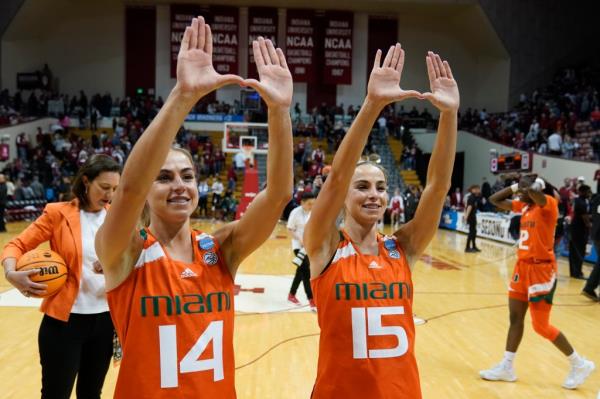 Haley and Hanna Cavinder in Miami uniforms. 