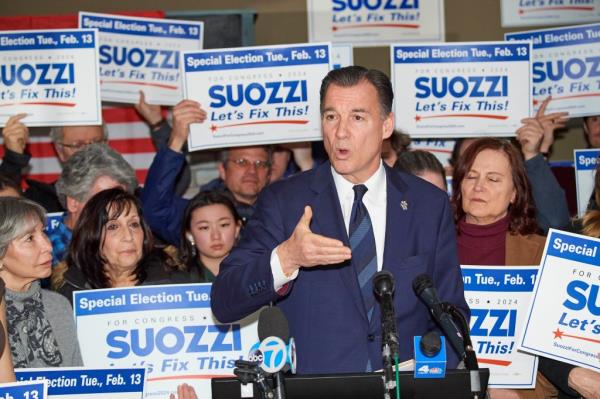 Mazi Pilip speaking at a rally ahead of the special election, with Peter King in the background.