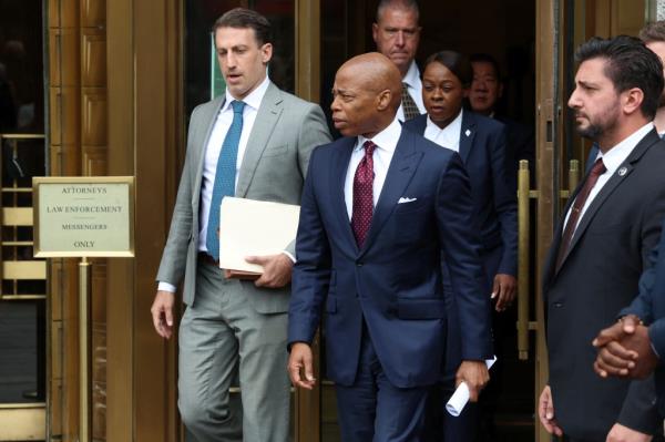 New York City Mayor Eric Adams walking outside federal court after his arraignment on charges of bribery and illegal solicitation of campaign contributions