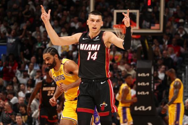 Tyler Herro (14) of the Miami Heat celebrates a three point basket during the game against the Los Angeles Lakers on December 4, 2024 at Kaseya Center in Miami, Florida.