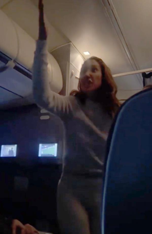 A woman forced a United Airlines flight to divert after she refused to take her seat and tried calling the flight attendants' bluff. 