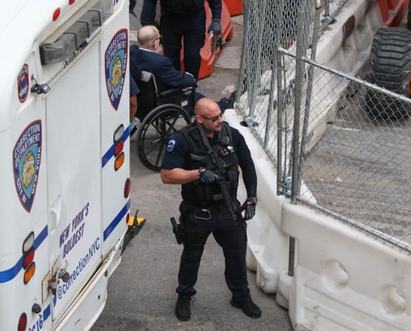 Harvey Weinstein leaving Bellevue Hospital in New York, escorted by armed NYCD ESU officers to court