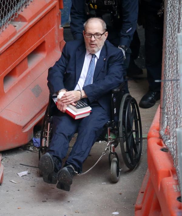 Harvey Weinstein leaving Bellevue Hospital in New York escorted by armed NYCD ESU officers on way to court