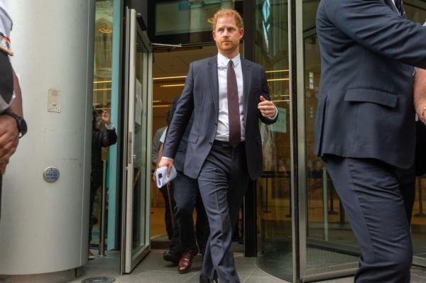Prince Harry, Duke of Sussex, exiting High Court in a suit and tie after giving evidence in a phone hacking trial