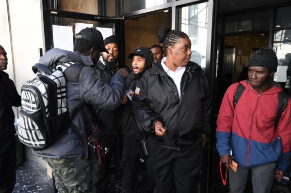 Members of the FDNY, Fire Marshals and NY State Fire close down the shelter at 320 W 31 St., NYC., due to unsafe co<em></em>nditions forcing all migrants out o<em></em>nto the street with directions to another shelter in Long Island City
