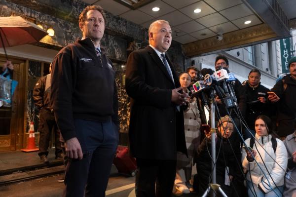 Zach Iscol, Commissio<em></em>ner of Emergency Management, and Manuel Castro, Commissio<em></em>ner of Immigrant Affairs (MOIA) standing in front of microphones